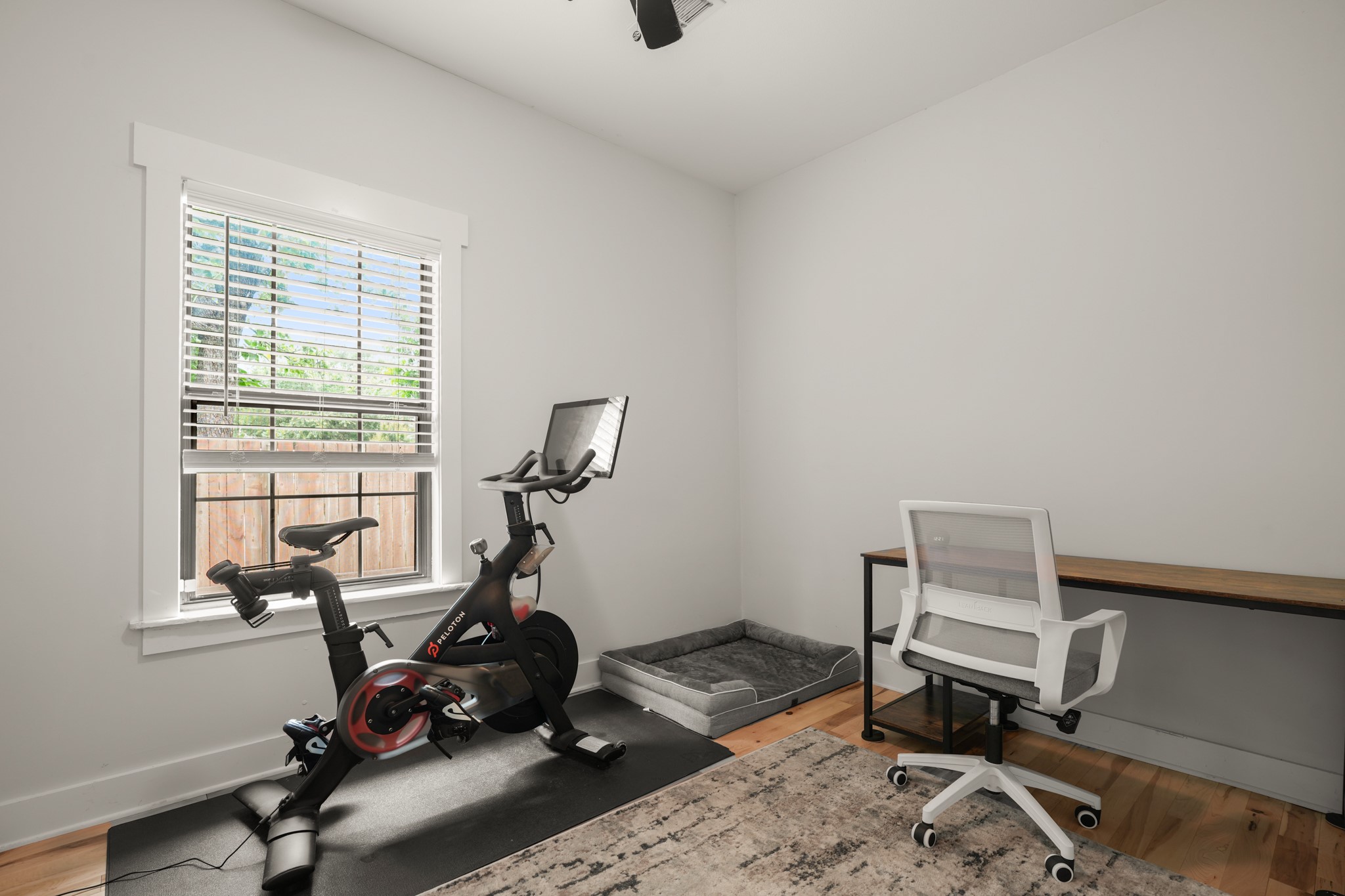 301 Old Thorndale Road Taylor, TX 76574 - Photo 22 of 29 A versatile space ready for a home office or fitness pursuits, complete with gleaming hardwood floors.