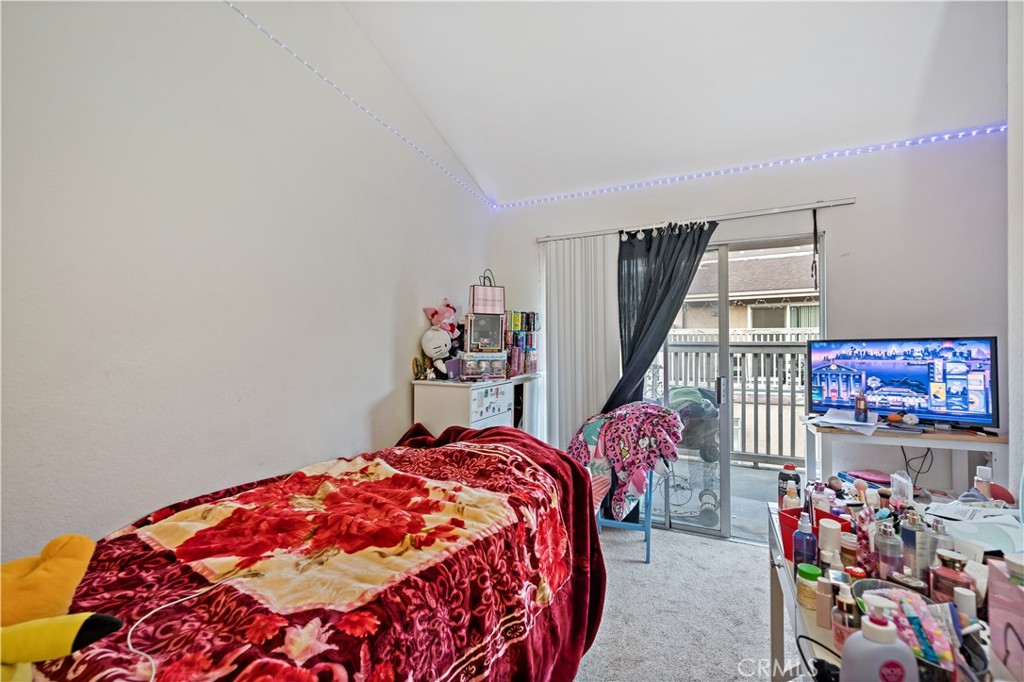 334 South Walnut Avenue Brea, CA 92821 - Photo 13 of 33 a bedroom with a bed and a chandelier