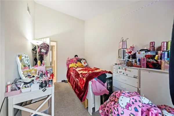 a bedroom with furniture and a bed