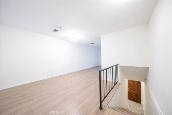 a view of a hallway with staircase