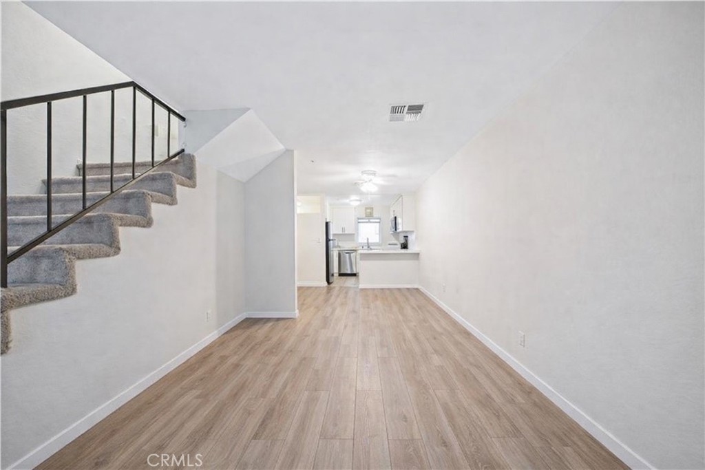 334 South Walnut Avenue Brea, CA 92821 - Photo 4 of 33 a view of a hallway with wooden floor and staircase