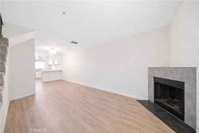 a kitchen with stainless steel appliances a sink stove and microwave