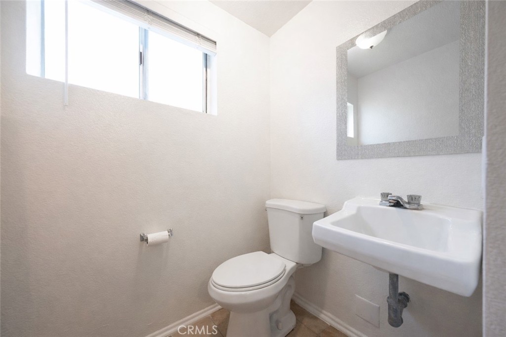 334 South Walnut Avenue Brea, CA 92821 - Photo 8 of 33 a bathroom with a sink mirror and toilet