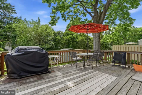 a view of a wooden deck with furniture