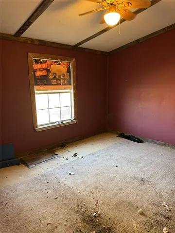 en empty room with windows