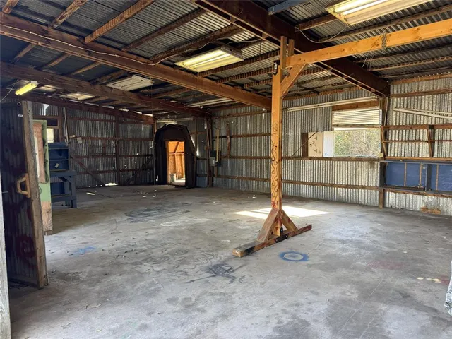 a view of a room with wooden walls