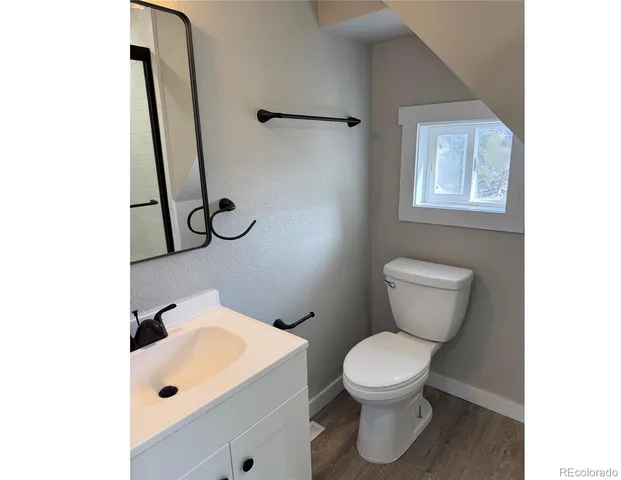 a bathroom with a toilet and a sink