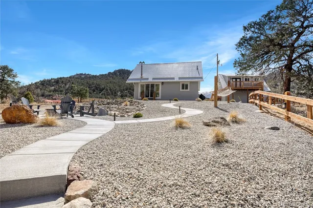 a view of a backyard with a sitting area