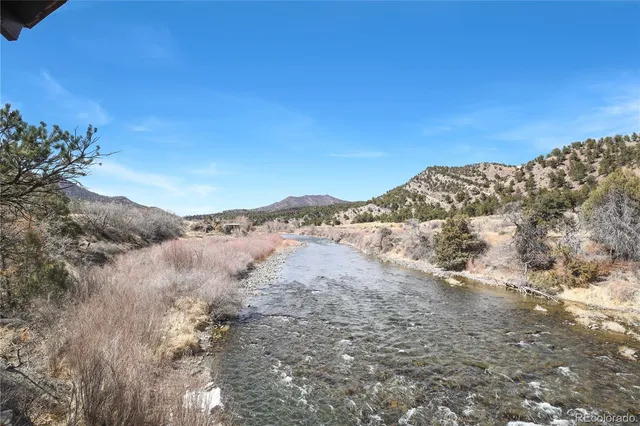 a view of a town with mountains in the background