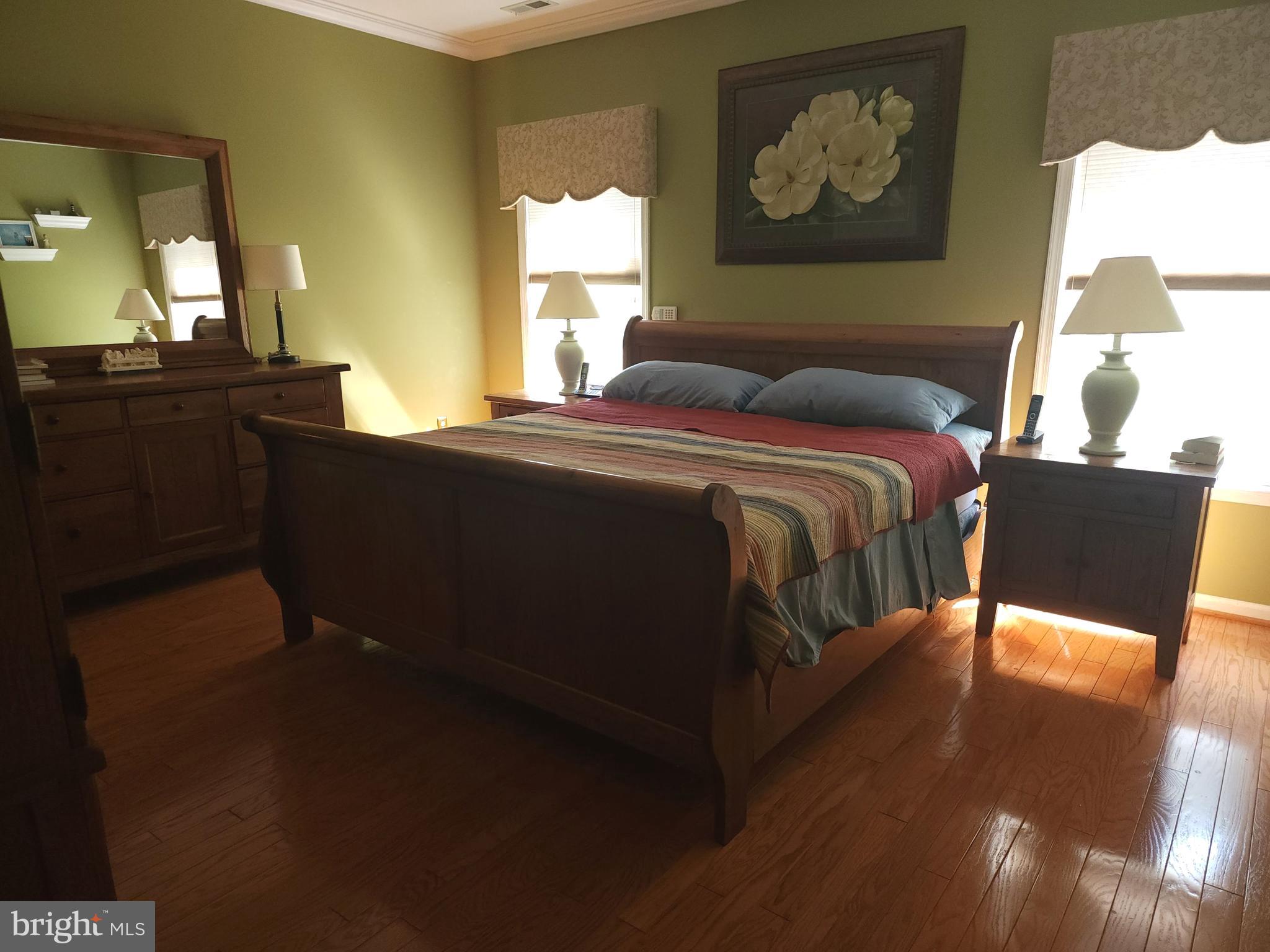 33 Sunset Lane Columbus, NJ 08022 - Photo 13 of 29 a bedroom with a bed and wooden floor