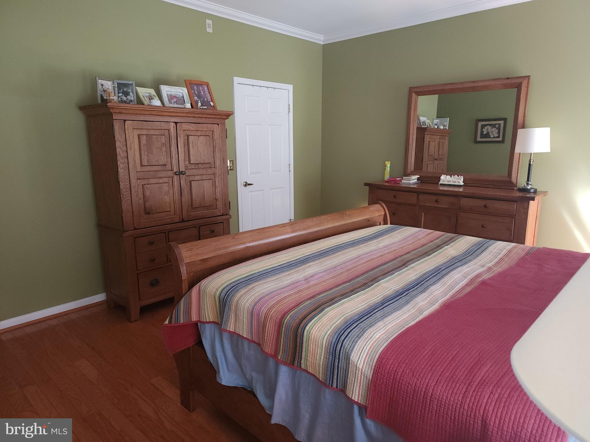 33 Sunset Lane Columbus, NJ 08022 - Photo 15 of 29 a bedroom with a bed and wooden floor