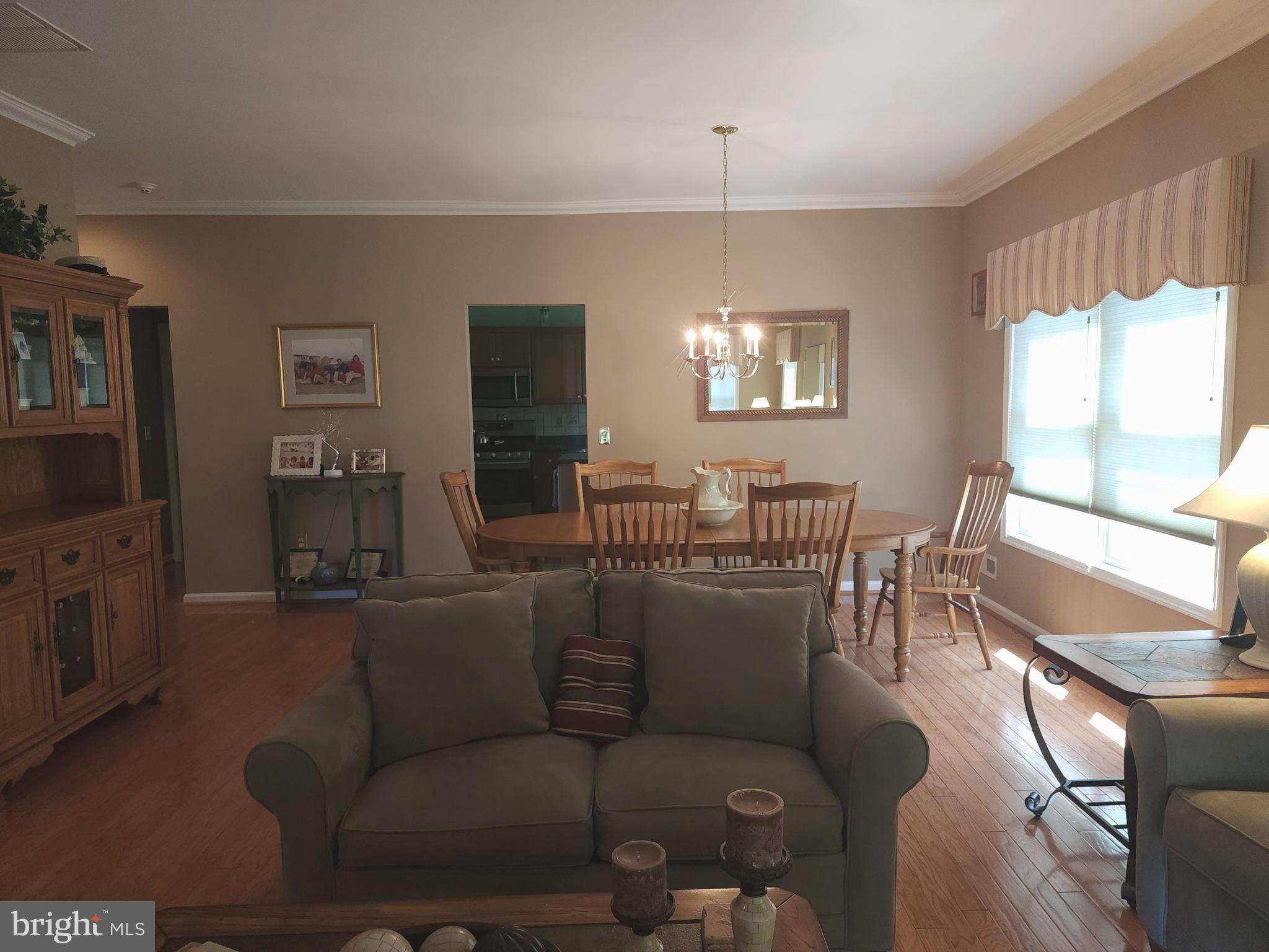 33 Sunset Lane Columbus, NJ 08022 - Photo 20 of 29 a living room with furniture a flat screen tv and a window