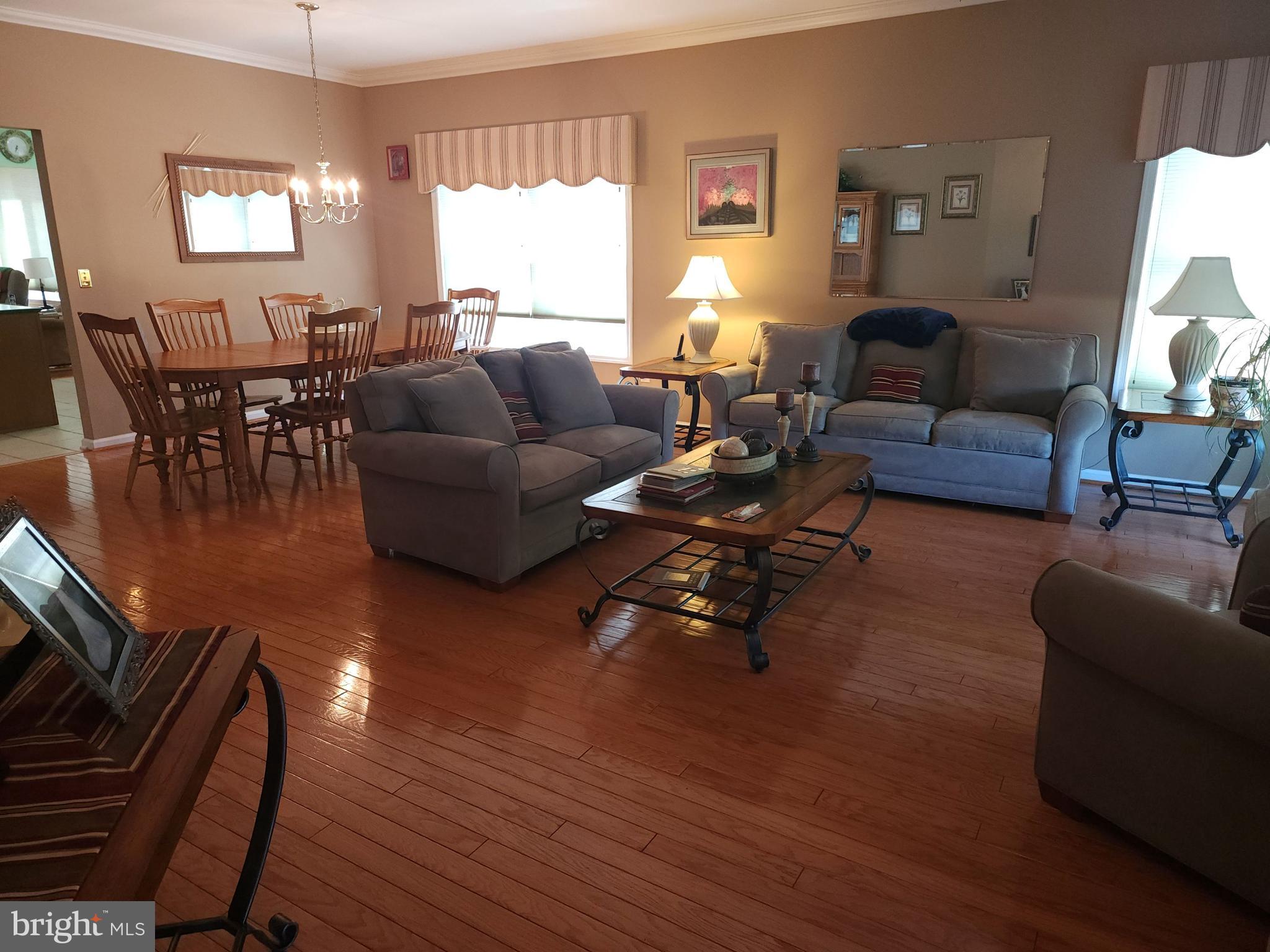 33 Sunset Lane Columbus, NJ 08022 - Photo 25 of 29 a living room with fireplace furniture and a wooden floor