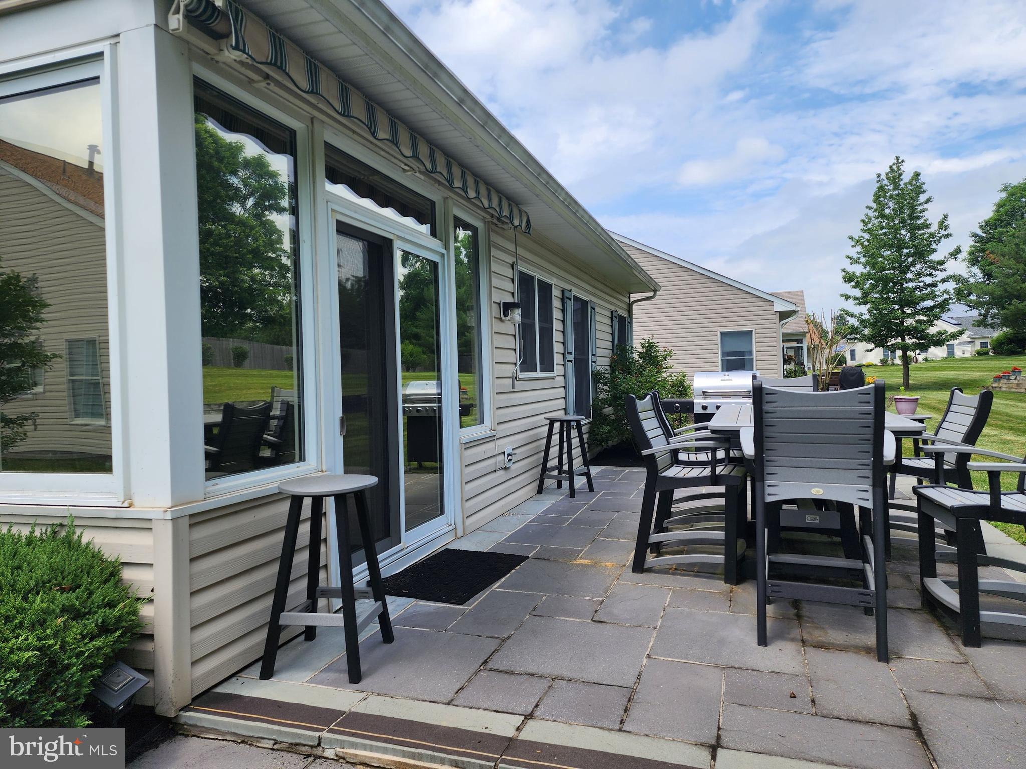 33 Sunset Lane Columbus, NJ 08022 - Photo 4 of 29 a view of a patio with table and chairs and potted plants