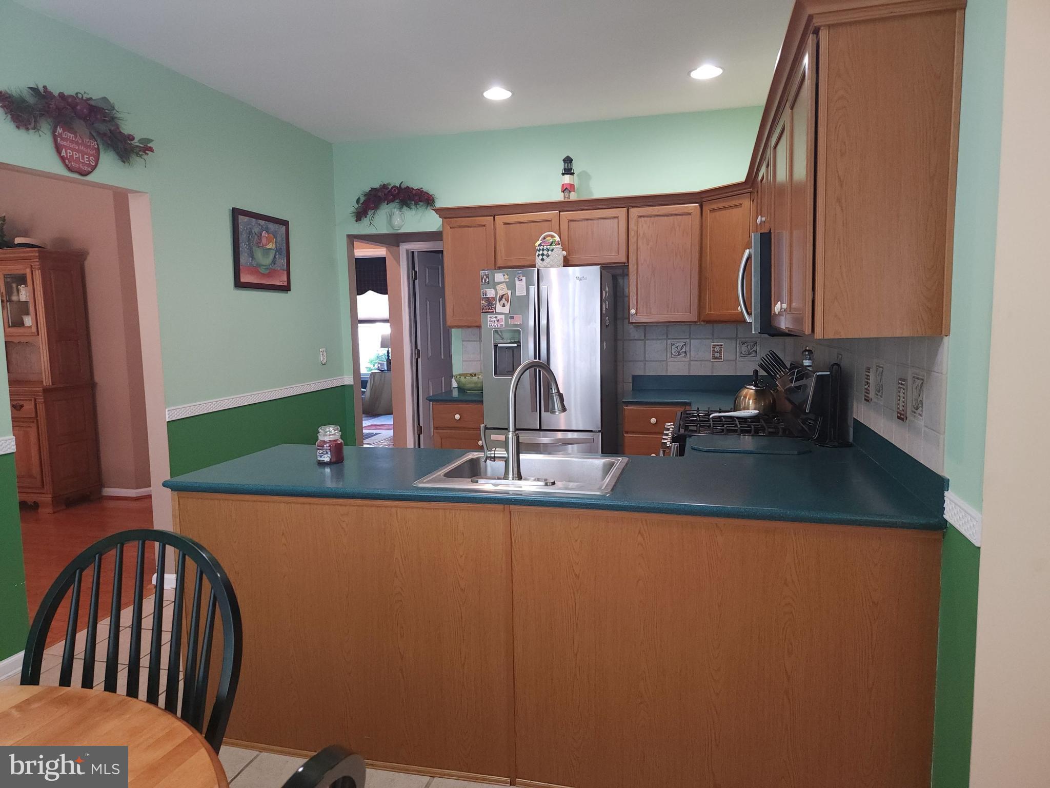 33 Sunset Lane Columbus, NJ 08022 - Photo 7 of 29 a view of a kitchen with kitchen island a sink a counter top space and stainless steel appliances