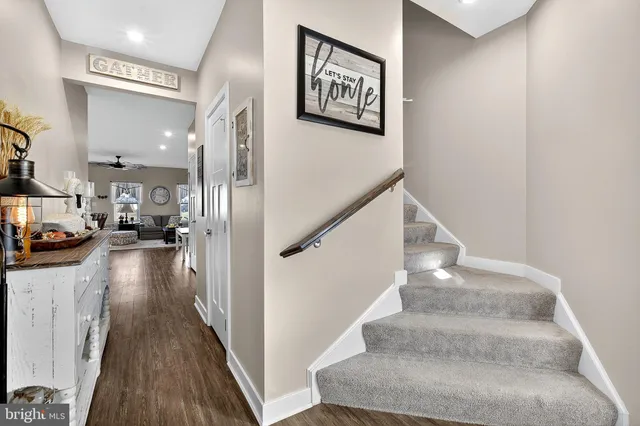 a bedroom with furniture and a wooden floor