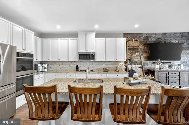 a bedroom with a bed and a television