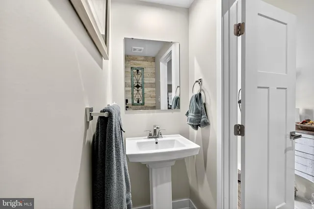 a room with furniture pool table and wall paintings