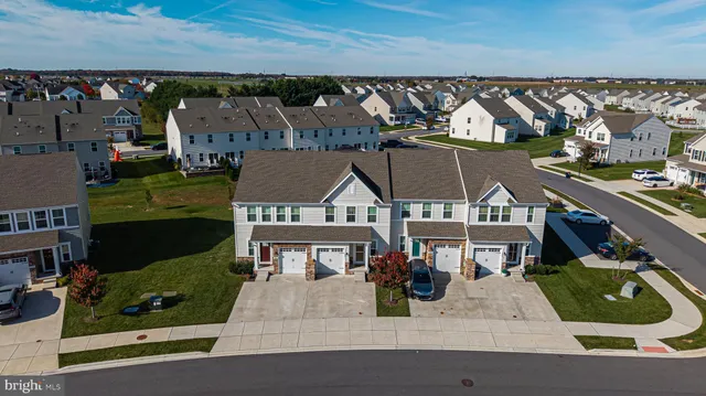 an aerial view of a house with a garden