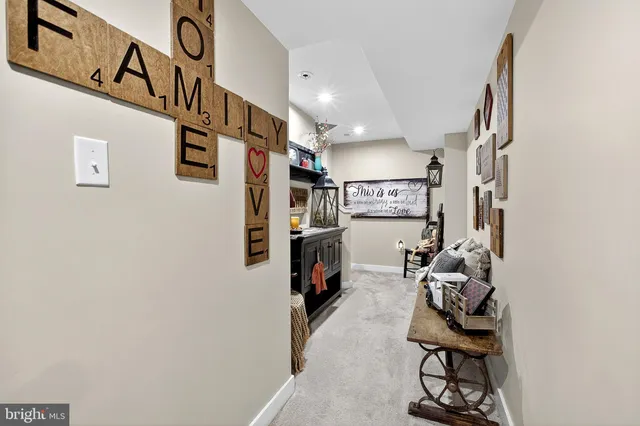 an aerial view of a house with a garden and lake view