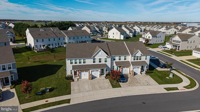 an aerial view of a house with a ocean view