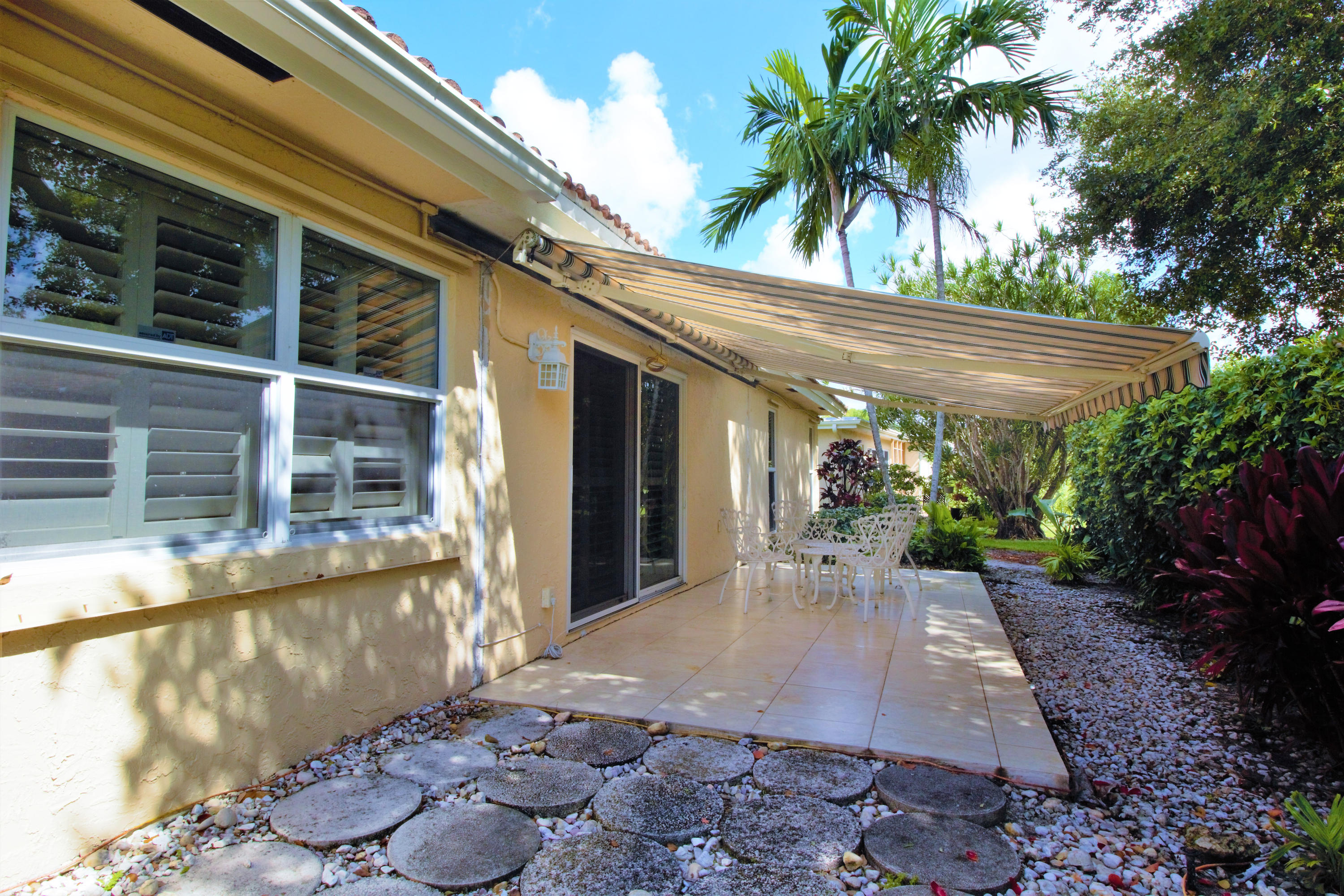 7897 Cloverfield Circle Boca Raton, FL 33433 - Photo 5 of 28 7897 back patio_awning