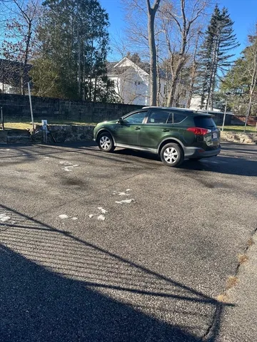 a view of a car in front of a house