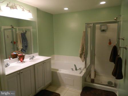 5112 Key View Way Perry Hall, MD 21128 - Photo 11 of 15 a bathroom with a tub sink and mirror