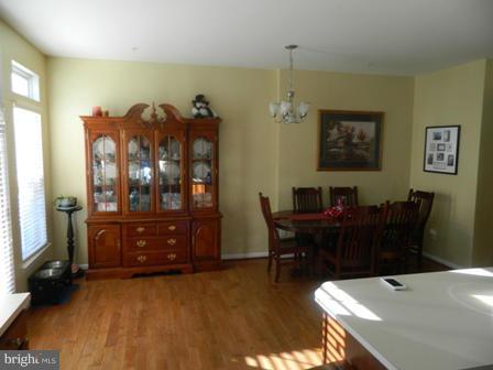 5112 Key View Way Perry Hall, MD 21128 - Photo 3 of 15 a view of a dining room with furniture and chandelier