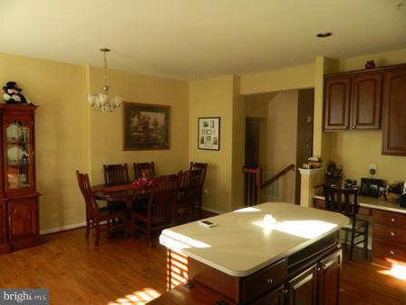 5112 Key View Way Perry Hall, MD 21128 - Photo 4 of 15 a room with a table chairs and appliances