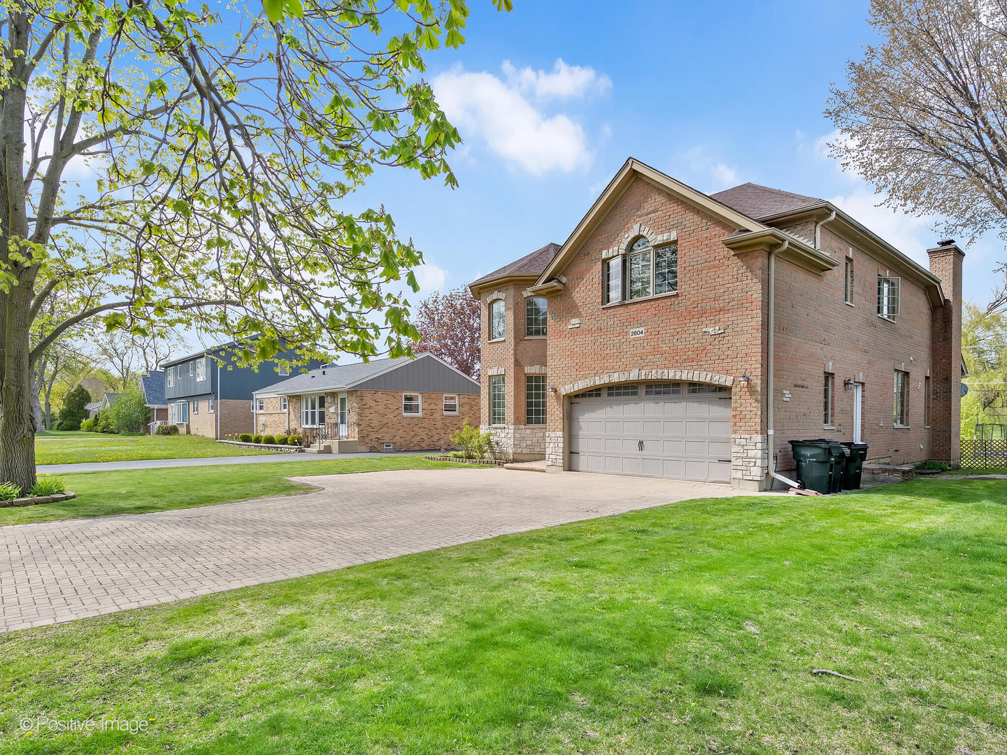 2804 Central Road Glenview, IL 60025 - Photo 2 of 41 a front view of a house with a yard and garage