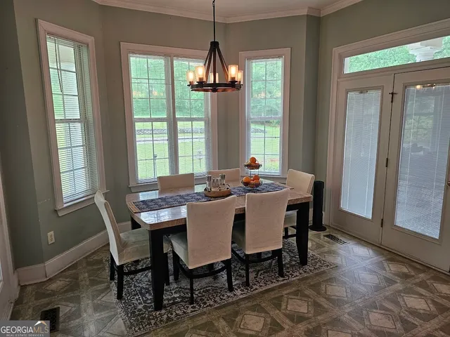 a dining room with furniture window wooden floor