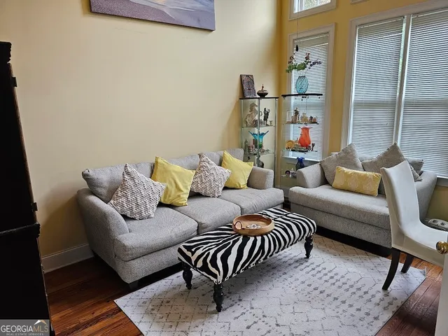 a living room with furniture and a rug