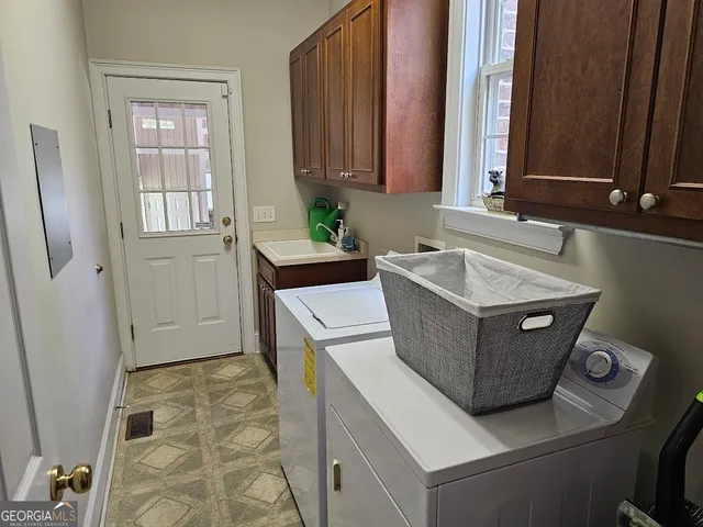 a utility room with washer and dryer