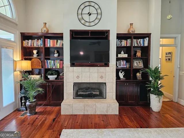 a living room with furniture and a fireplace
