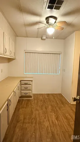 a view of storage and utility room with a window