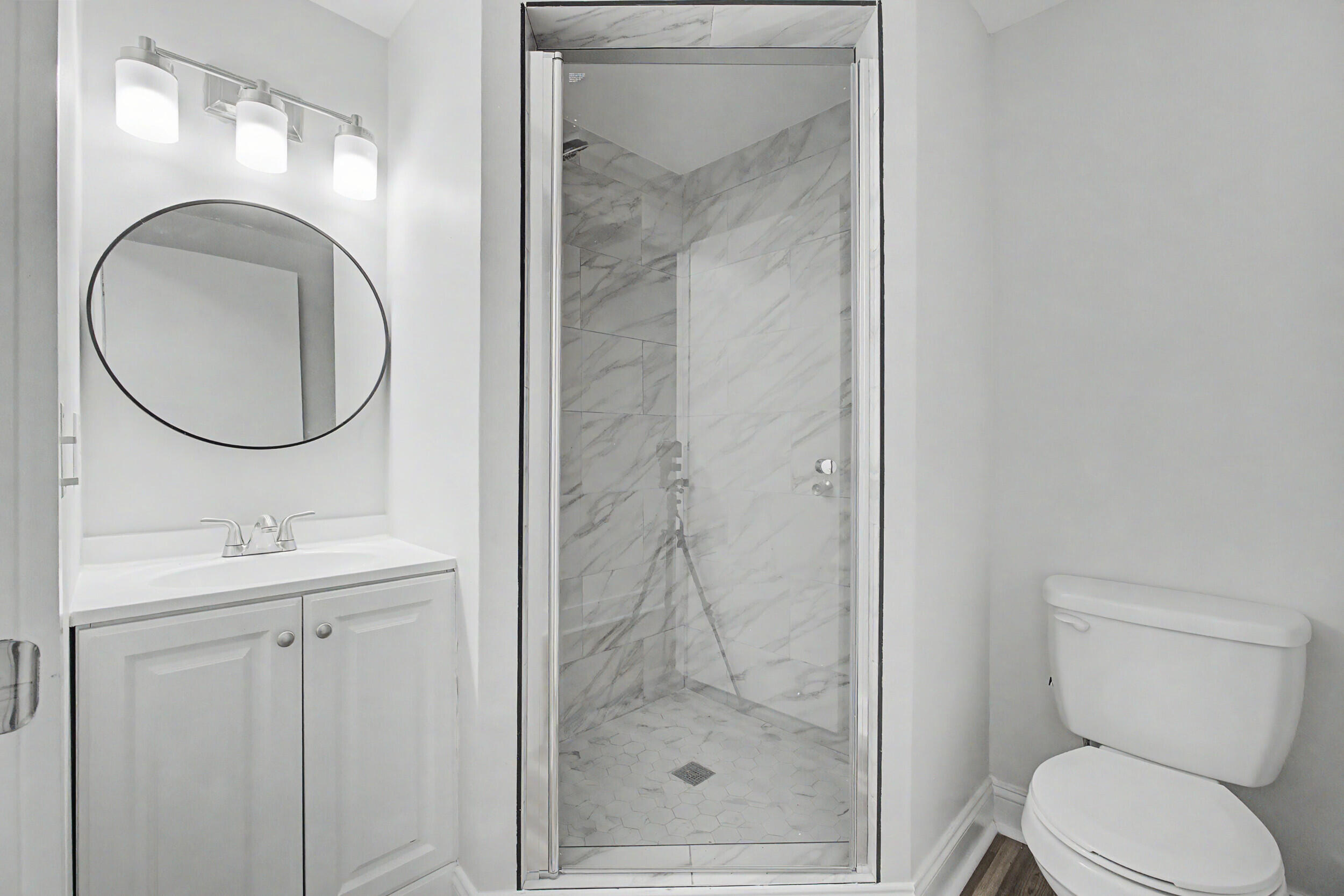 3016 Wagener Road Aiken, SC 29801 - Photo 20 of 29 a bathroom with a toilet a sink and a mirror
