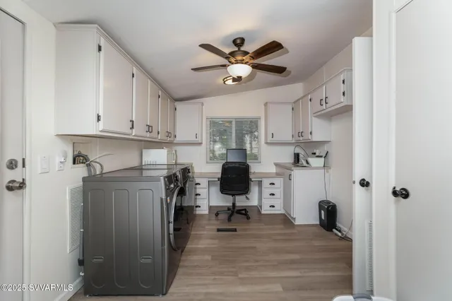 a view of a kitchen with workspace and a window