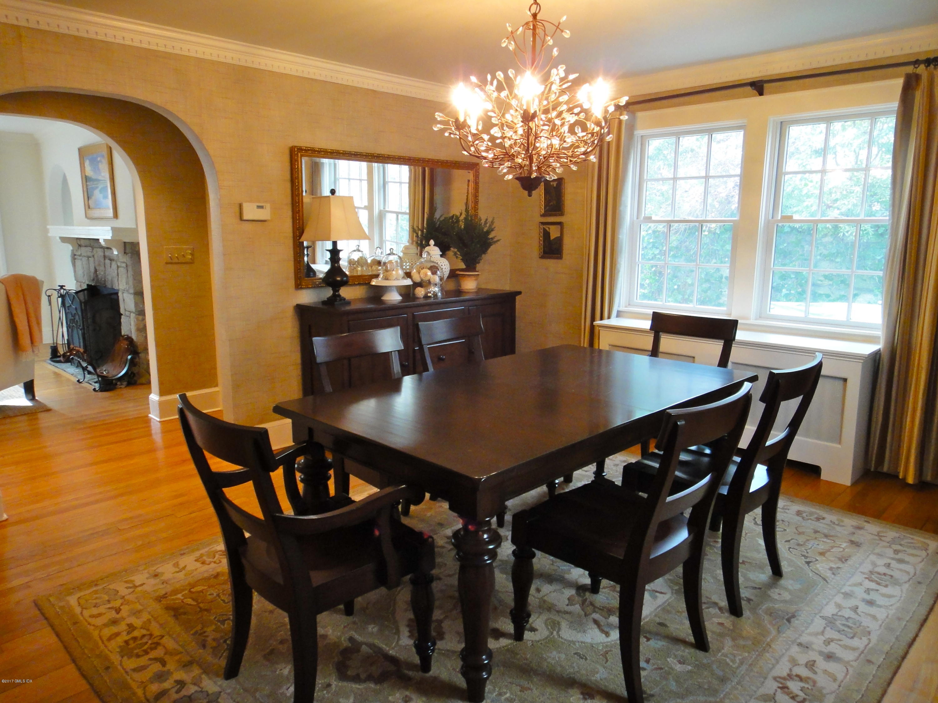 54 Valleywood Road Cos Cob, CT 06830 - Photo 3 of 26 a view of a dining room with furniture and chandelier