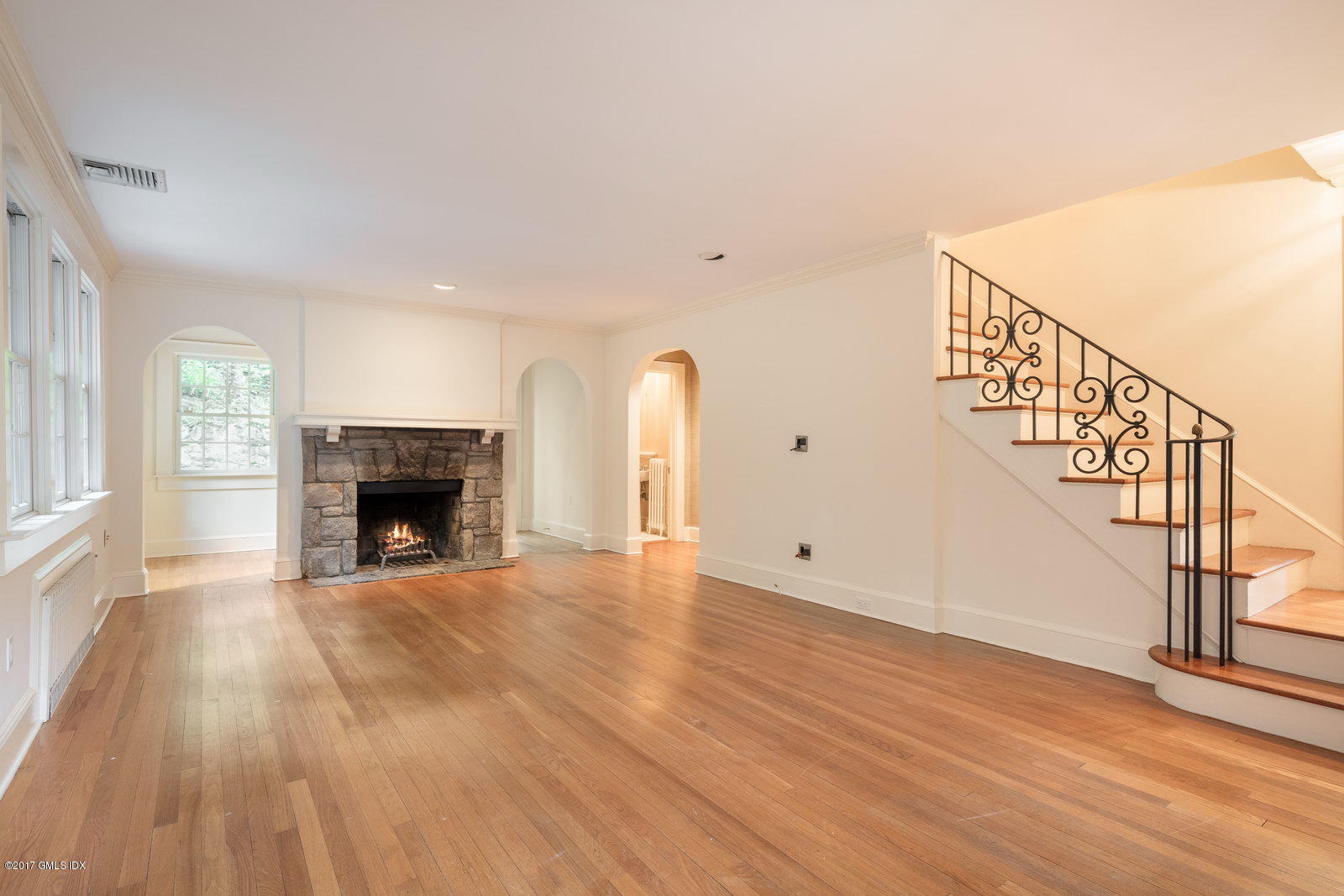 54 Valleywood Road Cos Cob, CT 06830 - Photo 8 of 26 a view of empty room with wooden floor and fireplace