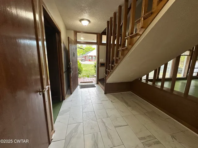 a view of empty room with floor to ceiling window