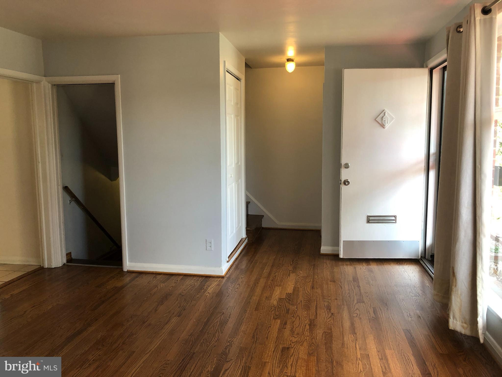 3810 Bancroft Road Baltimore, MD 21215 - Photo 3 of 19 an empty room with wooden floor and a window