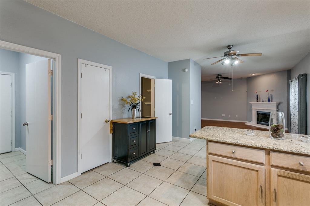 307 Pointer Place Arlington, TX 76002 - Photo 12 of 25 a spacious bathroom with a granite countertop sink and a mirror