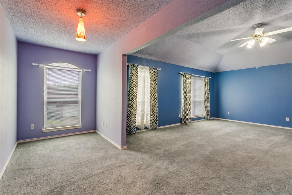 307 Pointer Place Arlington, TX 76002 - Photo 15 of 25 an empty room with chandelier fan and windows