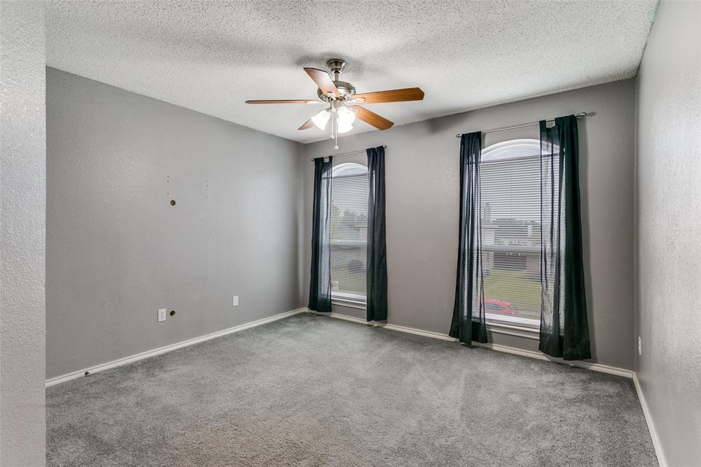307 Pointer Place Arlington, TX 76002 - Photo 22 of 25 a view of an empty room with a ceiling fan