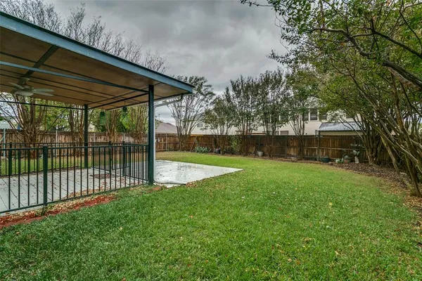 a view of backyard with green space