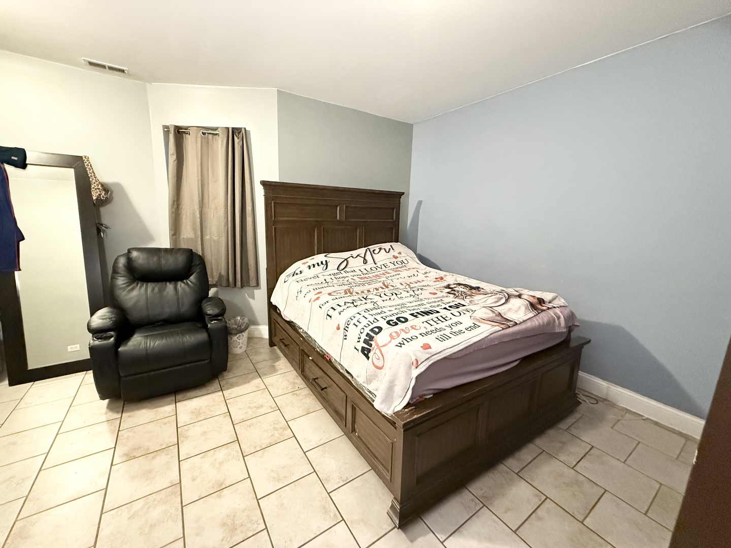 6035 South St Lawrence Avenue, Unit GS Chicago, IL 60637 - Photo 11 of 17 a bedroom with a bed and a rug