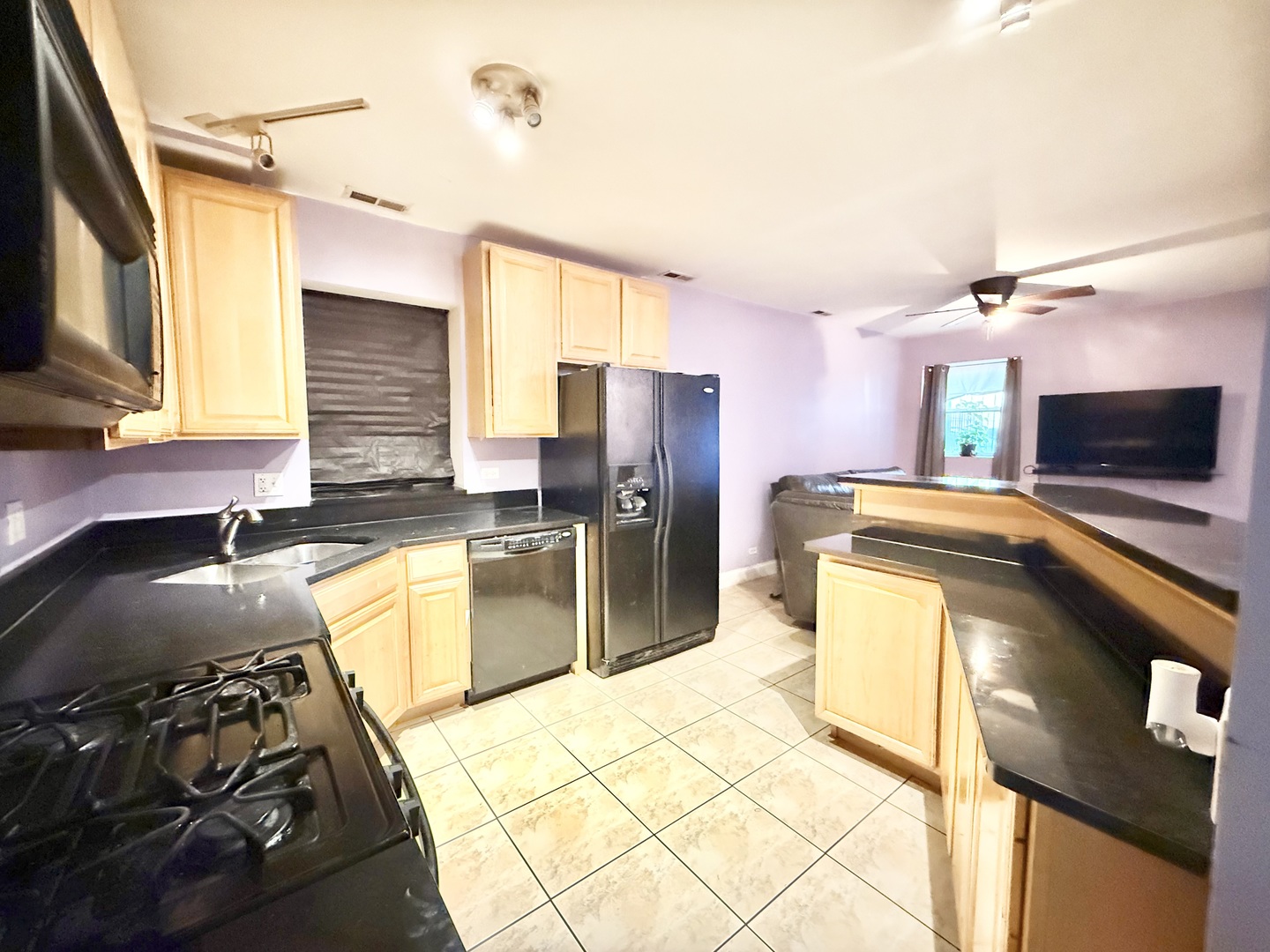 6035 South St Lawrence Avenue, Unit GS Chicago, IL 60637 - Photo 3 of 17 a kitchen with a sink stove and refrigerator