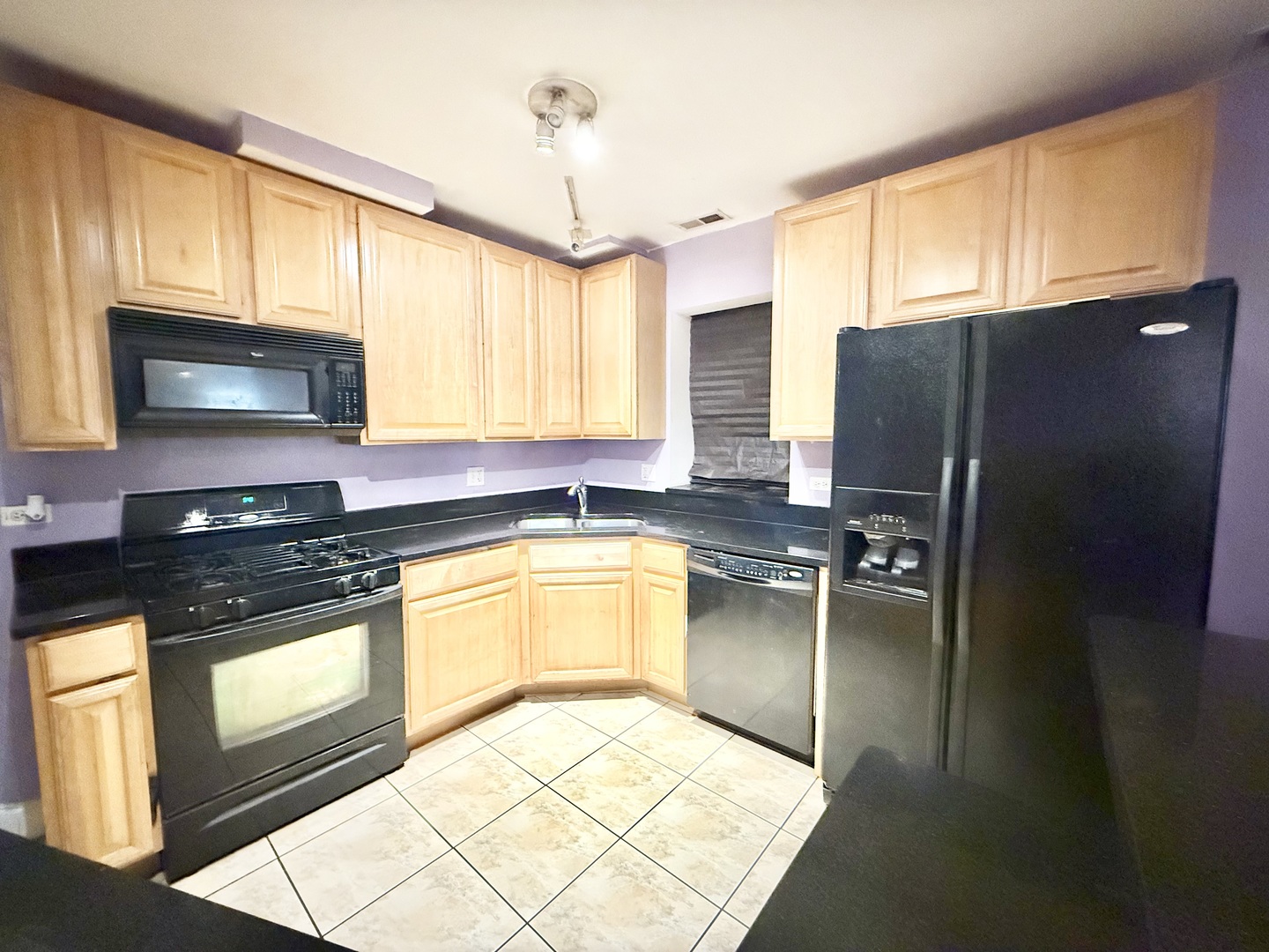 6035 South St Lawrence Avenue, Unit GS Chicago, IL 60637 - Photo 5 of 17 a kitchen with stainless steel appliances granite countertop a refrigerator a stove a sink dishwasher and microwave oven