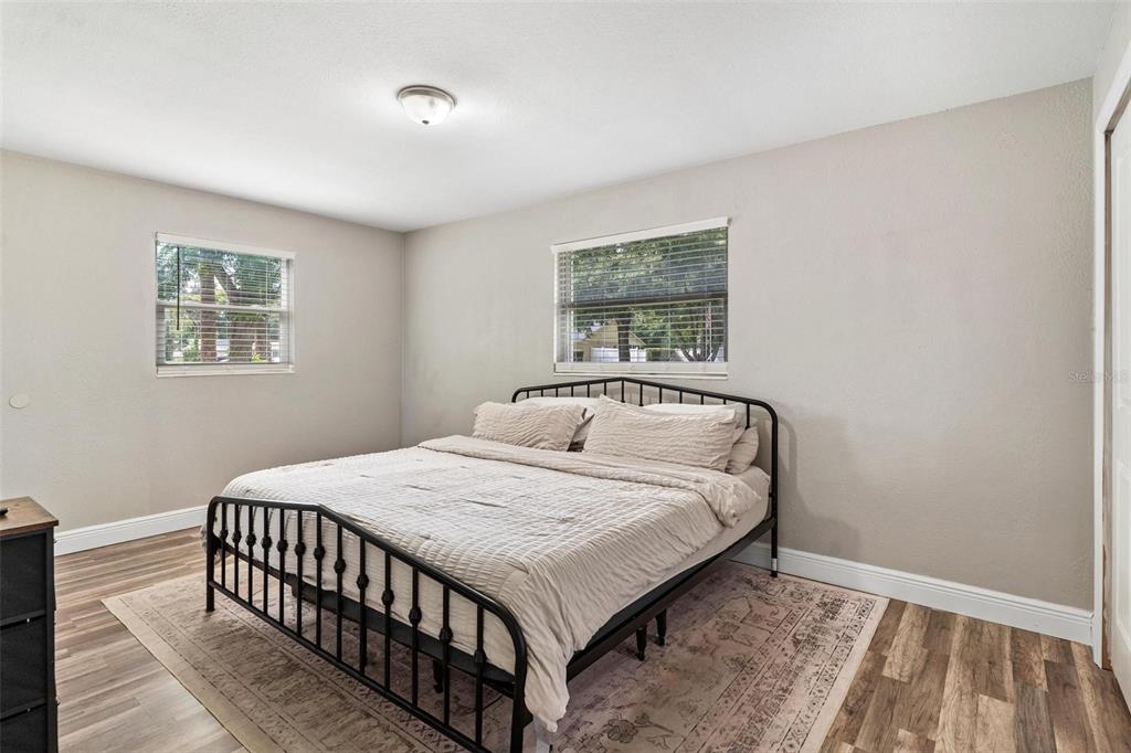 398 Rose Street Umatilla, FL 32784 - Photo 14 of 30 a bedroom with a bed and a window